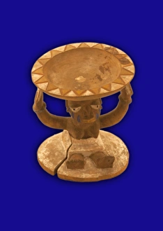 <b class=qtipBold><figcaption>ifa bowl, Nigerian, 1800-1878</figcaption></b><br>Ifa bowl. Shallow dish held aloft by seated female figure. Applied blue, white, yellow and red pigments. Carved from a single piece of wood. ifa bowl, Nigerian, 1800-1878