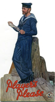 <b class=qtipBold><figcaption>Navy sailor cut-out, 1954</figcaption></b><br>Player's Navy Cut cut-out counter-card of a sailor leaning against a wooden post reading a paper. The sailor wears full navy coloured naval uniform and "HMS EXCELLENT" is written on his cap band. Text below in red reads: "Player's // Please". The sailor lifebuoy trademark can be seen in the bottom right corner.<br><em>© Produced by the kind permission of Imperial Tobacco Limited, England</em> Navy sailor cut-out, 1954
